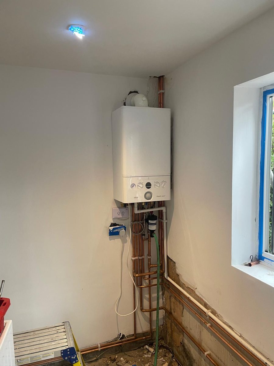 New combi boiler and copper pipework during a central heating installation